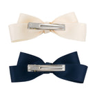 Large Satin Double Bow Clip Set featuring one cream and one navy blue bow clip, viewed from the back with silver alligator clips.