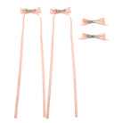 Ivory ribbon bow clip set of four, two with long streamers and two smaller clips.