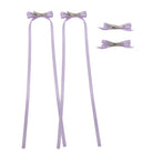 Light purple ribbon bow clip set featuring two clips with long ribbons and two smaller bow clips, all with silver alligator clips.
