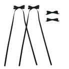 Four black ribbon bow clips, two with long tails, and two smaller standalone, displayed on a white background.