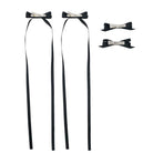Four black ribbon bow clip set with silver alligator clips, two featuring long trailing ribbons.