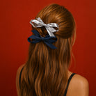 Light denim and silver Bow Clip Set styled in a woman's long, wavy hair.