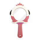Pink and white polka-dotted handheld mirror.
