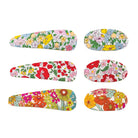 Floral hair clip set by Liberty, featuring six clips with varied patterns, colors, and shapes.