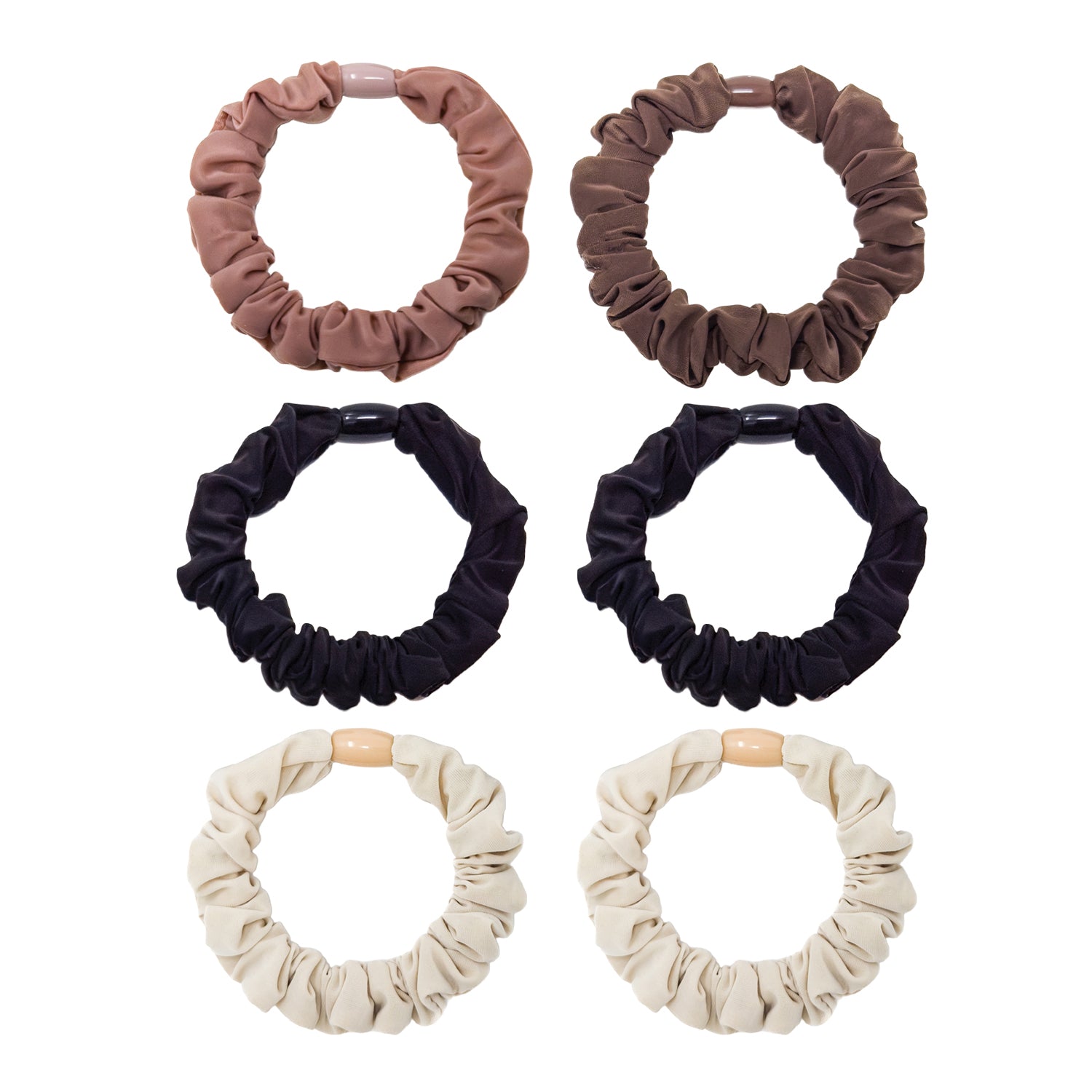 Set of six neutral-colored scrunchies: light pink, brown, black, and cream soft gathered fabric with plastic connectors.