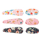 Floral hair clip set of 6 by Liberty, featuring three distinct colorful floral patterns on fabric in elongated and oval shapes.